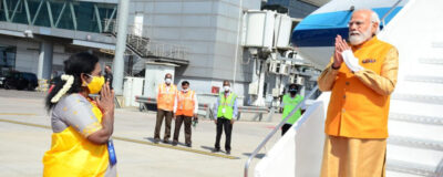 Tamilisai Soundararajan is receiving The Shri Narendra Modi at Rajiv Gandhi International Airport in Hyderabad