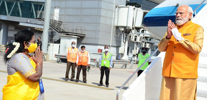 Tamilisai Soundararajan is receiving The Shri Narendra Modi at Rajiv Gandhi International Airport in Hyderabad